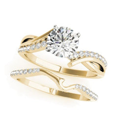 Crisscross diamond engagement ring in yellow gold